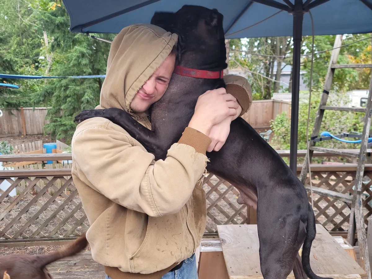 Happy dog hugging